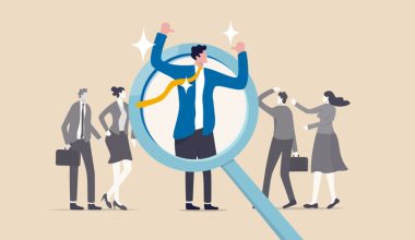 A cartoon businessperson under a magnifying glass with others blurred in the background.