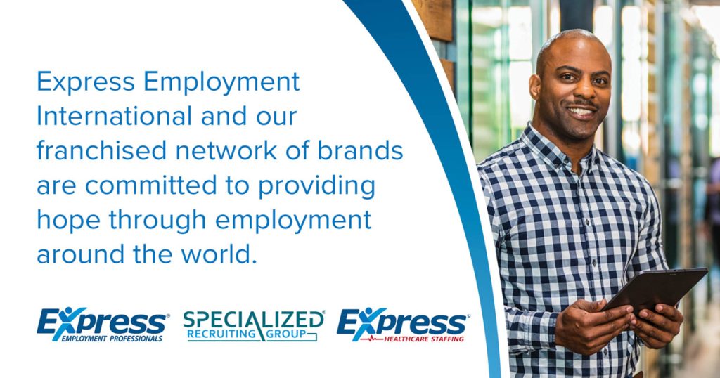 A man holding a tablet in an office corridor next to text about Express Employment International's commitment to employment. Logos for Express Employment Professionals, Specialized Recruiting Group, and Express Healthcare Staffing are shown. Transcribed Text: Express Employment International and our franchised network of brands are committed to providing hope through employment around the world.