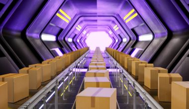 A logistics tunnel with conveyor belts moving rows of cardboard boxes toward a bright dispatch point, illuminated by purple and yellow lights. The high‑tech setup evokes peak‑season fulfillment, with automated systems pushing a steady flow of packages through a streamlined, high‑volume distribution environment.